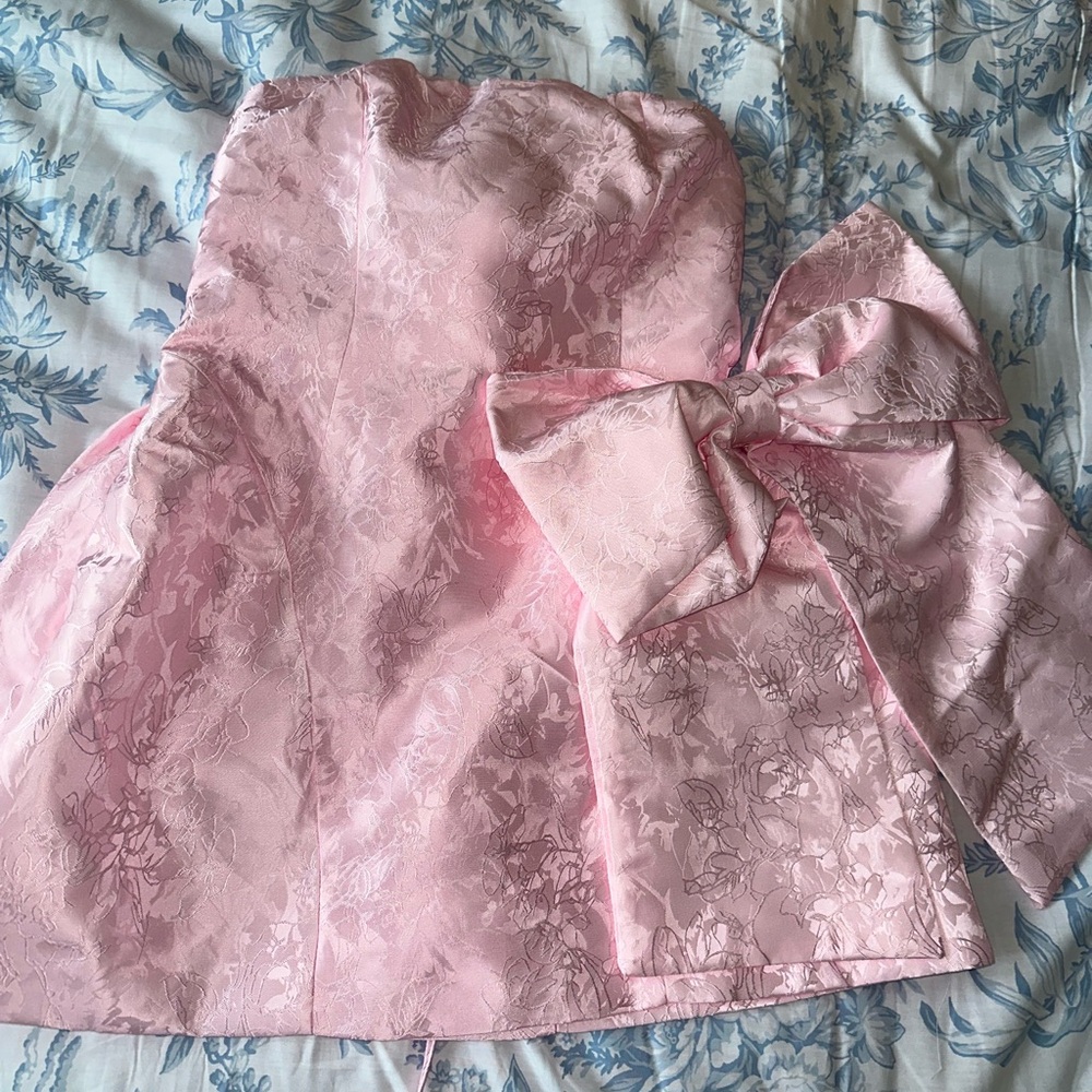 Pink strapless mini dress with attachable bow to back